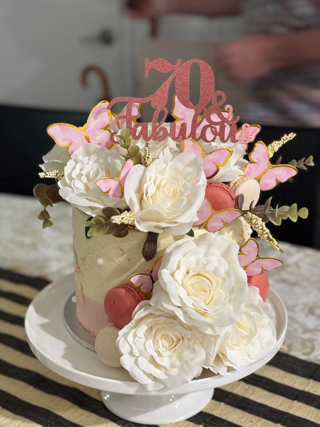 Floral milestone birthday cake with roses and butterflies